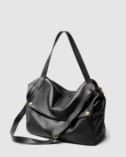 Bolso de piel suave negro con diseño elegante y correas ajustables para uso diario