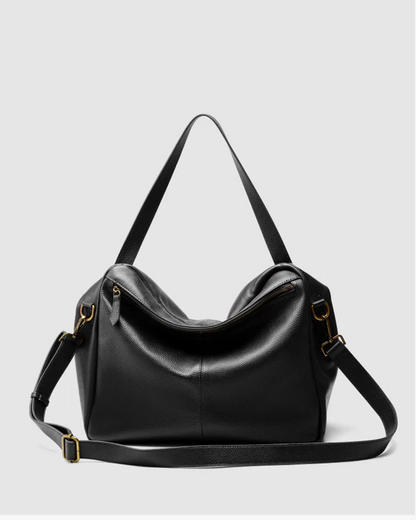 Bolso de piel suave negro con correas ajustables y cierre de cremallera para uso diario